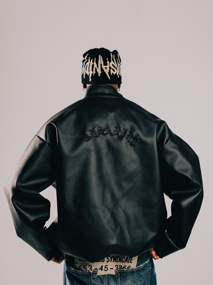 Insanidy knitwear black beanie at unseen grail. local brands south africa. streetwear. men and women. studio image male model back
