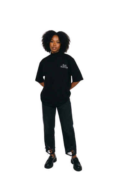 Kai Eleven black turtle kneck oversized graphic t shirt at unseen grail. local brands south africa. streetwear. men and women. female model front view full outfit