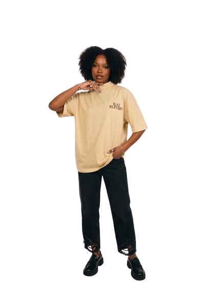 Kai Eleven cream turtle kneck oversized graphic t shirt at unseen grail. local brands south africa. streetwear. men and women. female model front view full outfit
