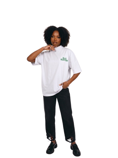 Kai Eleven white turtle kneck oversized graphic t shirt at unseen grail. local brands south africa. streetwear. men and women. female model front image full outfit