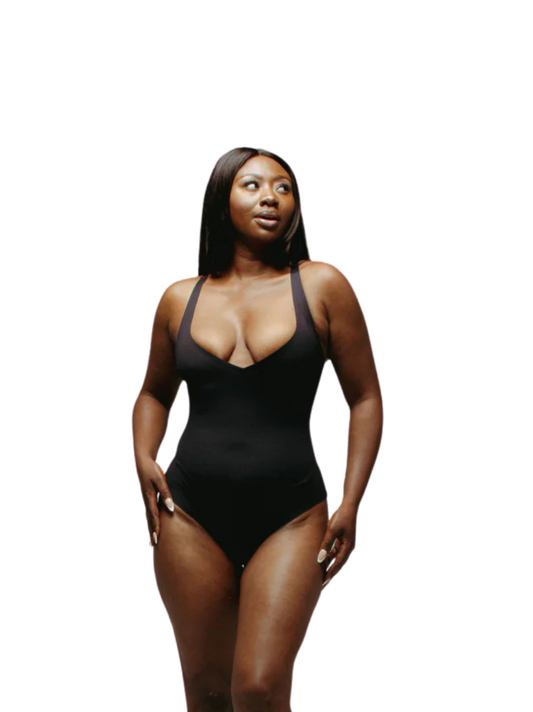 Kurv_black_body__thong_bodysuit_at_unseen_grail._local_brands_south_africa._streetwear._men_and_women.galxboy_bantu._Female_model_front_shot_half_body