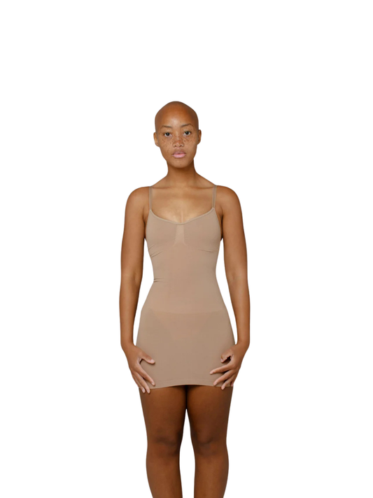 Kurv_tan_body__mini_dress_at_unseen_grail._local_brands_south_africa._streetwear._men_and_women.galxboy_bantu._Female_model_front_shot_close_up 