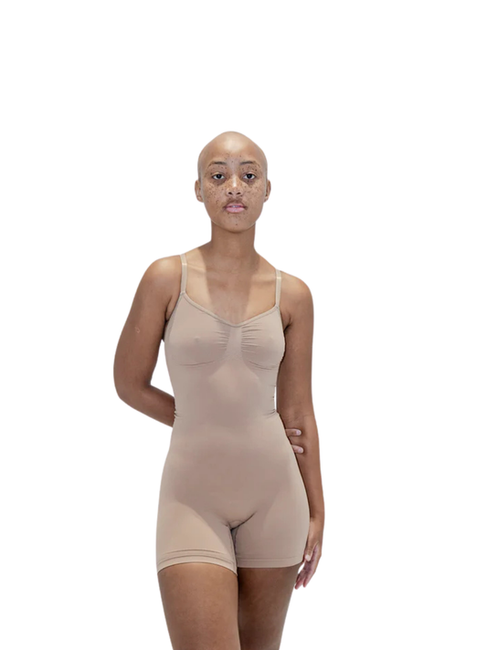 Kurv_tan_compression_bodysuit_at_unseen_grail._local_brands_south_africa._streetwear._men_and_women.galxboy_bantu._Female_model_front_shot_half_bofy