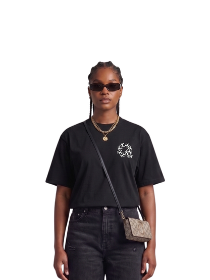 Mercha black oversized graphic t shirt at unseen grail. local brands south africa. streetwear. men and women. studio image female model front