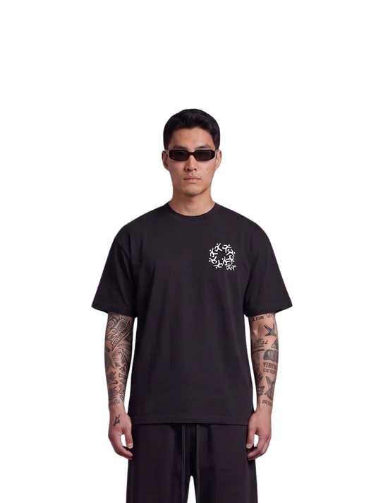 Mercha black oversized graphic t shirt at unseen grail. local brands south africa. streetwear. men and women. studio image male model front