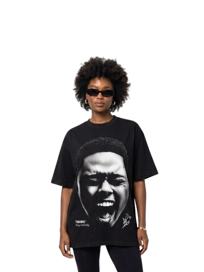 Mercha black oversized graphic vest at unseen grail. local brands south africa. streetwear. men and women. studio image a reece nasty c female model front