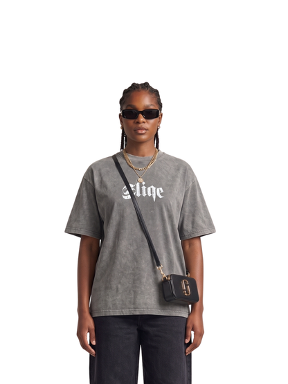 Mercha grey oversized graphic tshirt at unseen grail. local brands south africa. streetwear. men and women. studio image a reece nasty c sliqe galxboy front female model