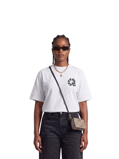 Mercha white oversized graphic t shirt at unseen grail. local brands south africa. streetwear. men and women. studio image front female model
