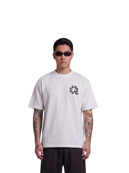 Mercha white oversized graphic t shirt at unseen grail. local brands south africa. streetwear. men and women. studio image front male model