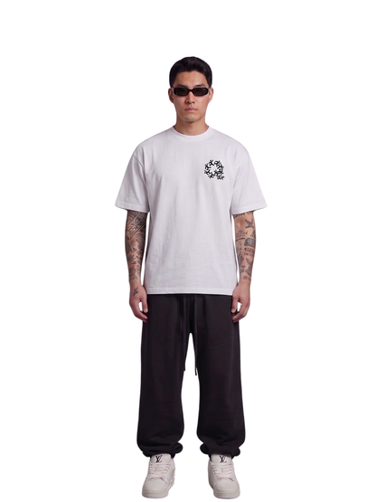 Mercha white oversized graphic t shirt at unseen grail. local brands south africa. streetwear. men and women. studio image full outfit male