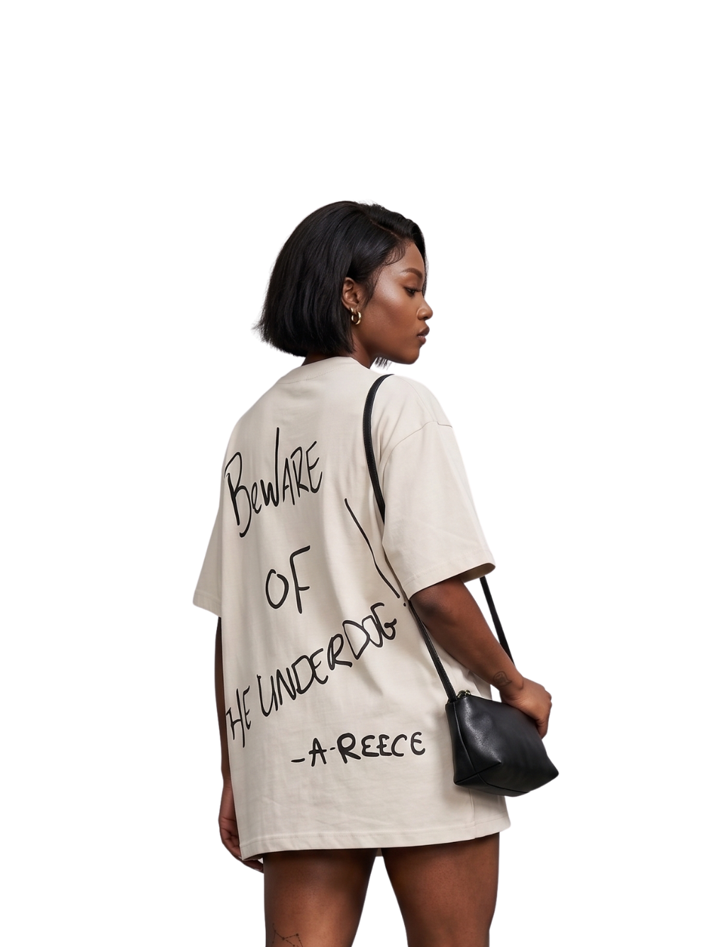 Mercha white oversized graphic tshirt at unseen grail. local brands south africa. streetwear. men and women. studio image a reece nasty c behind female model bantu