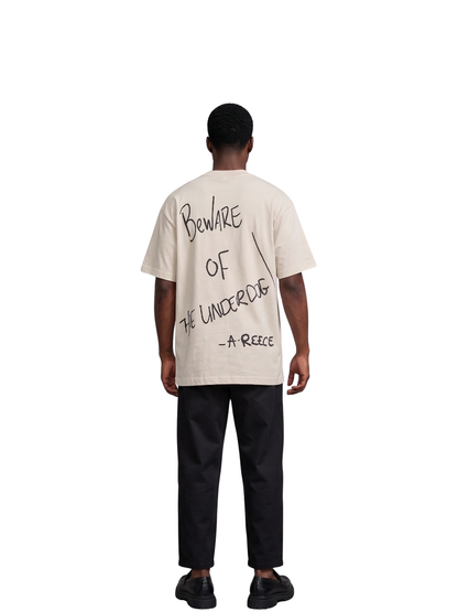 Mercha white oversized graphic tshirt at unseen grail. local brands south africa. streetwear. men and women. studio image a reece nasty c male model full outfit bantu