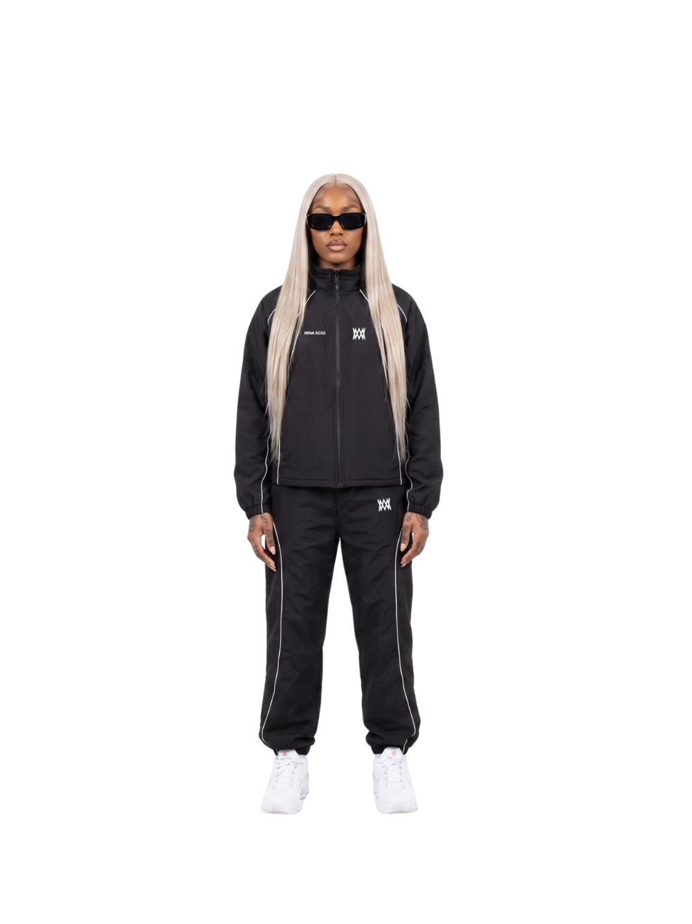 Mina Boss black oversized graphic tracksuit at unseen grail. local brands south africa. streetwear. men and women. studio image female model front. el patron