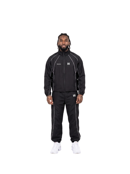 Mina Boss black oversized graphic tracksuit at unseen grail. local brands south africa. streetwear. men and women. studio image male model front