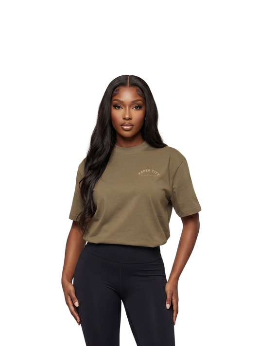 Paper city brown oversized graphic tshirt at unseen grail. local brands south africa. streetwear. men and women. female model front