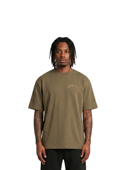 Paper city brown oversized graphic tshirt at unseen grail. local brands south africa. streetwear. men and women. male model front