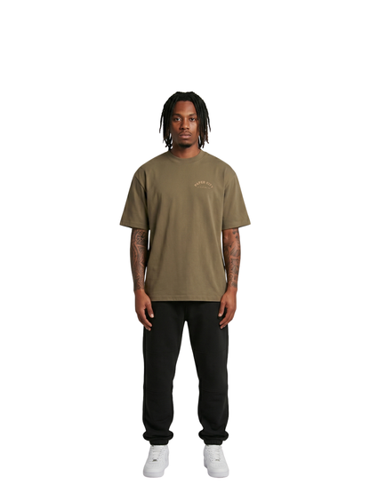 Paper city brown oversized graphic tshirt at unseen grail. local brands south africa. streetwear. men and women. male model front full outfit