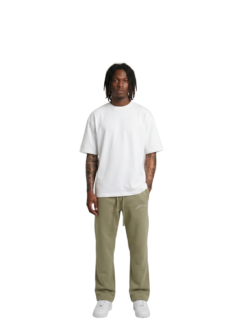 Paper city green oversized sweatpants  at unseen grail. local brands south africa. streetwear. men and women. female model front full outfit