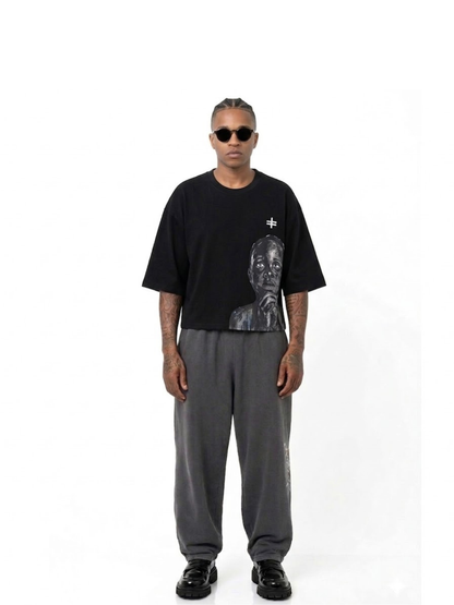 Rare Blaq black oversized graphic t shirt at unseen grail. local brands south africa. streetwear. men and women. male model front view image full outfit