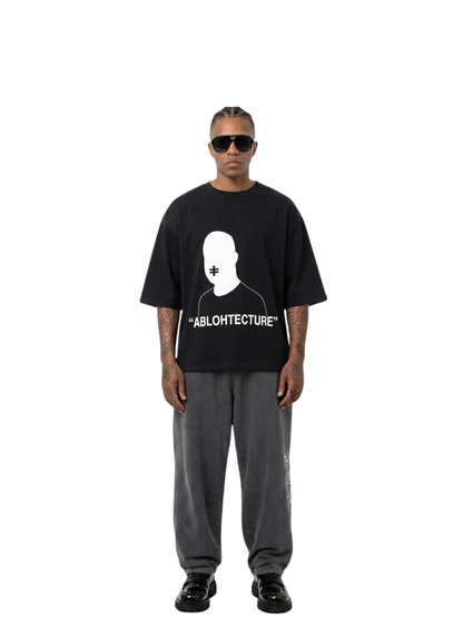 Rare Blaq black oversized graphic t shirt at unseen grail. local brands south africa. streetwear. men and women. studio image male model front full view