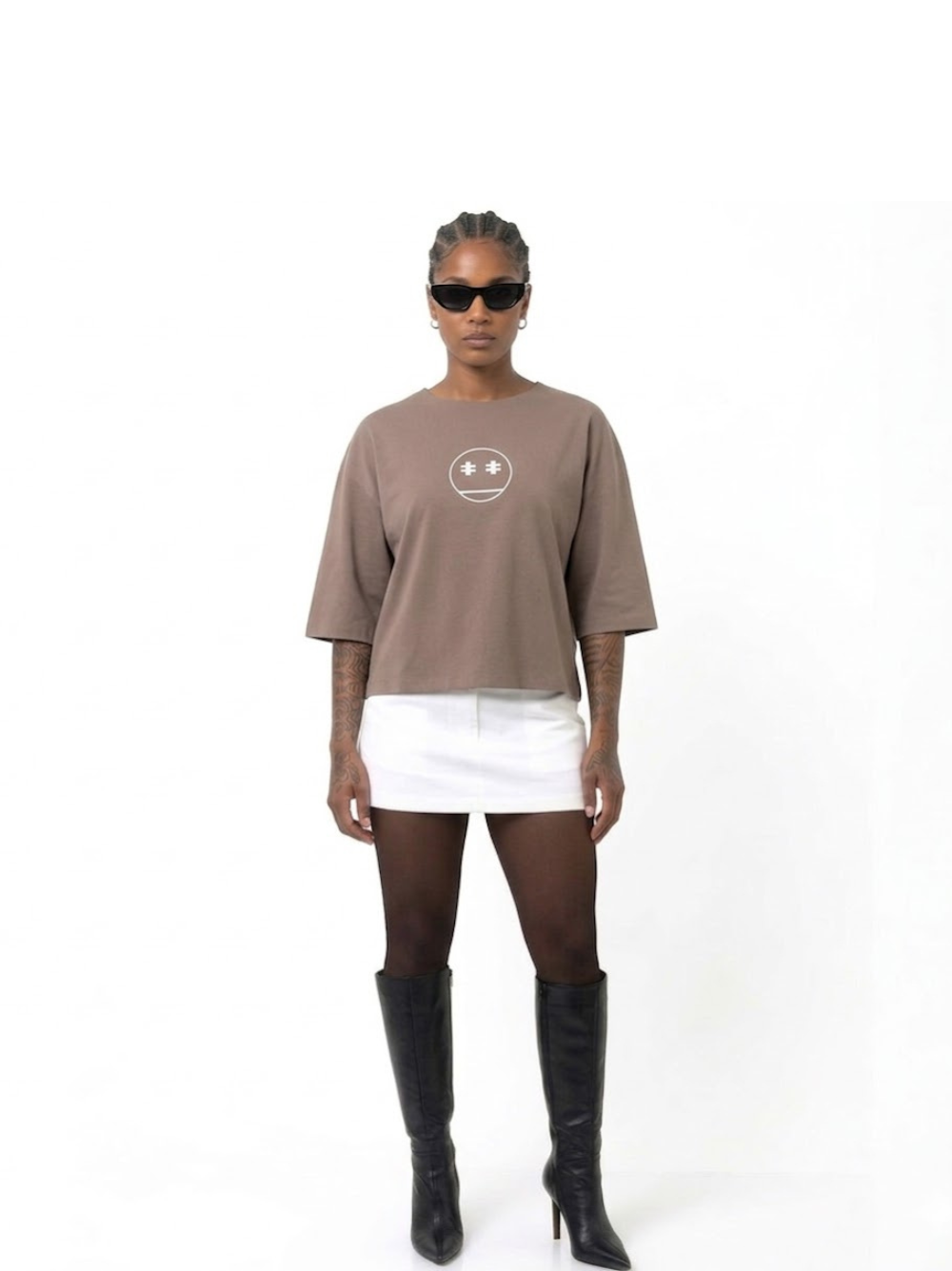 Rare Blaq brown oversized graphic t shirt at unseen grail. local brands south africa. streetwear. men and women. studio image female model full front image