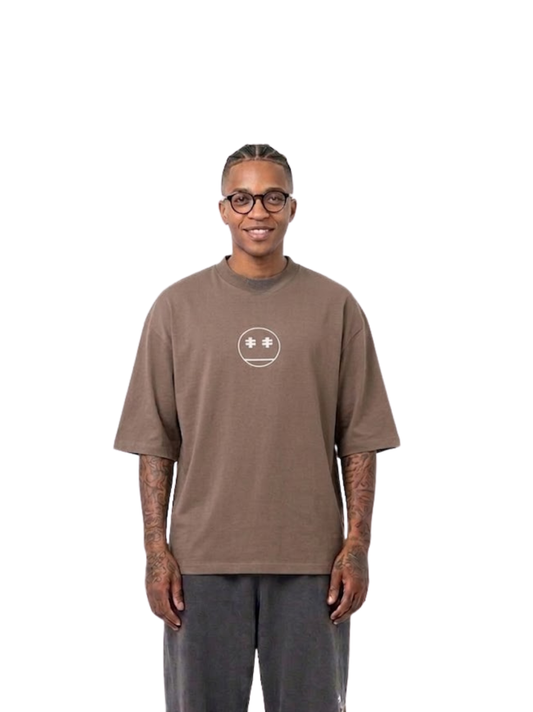 Rare Blaq brown oversized graphic t shirt at unseen grail. local brands south africa. streetwear. men and women. studio image male model front