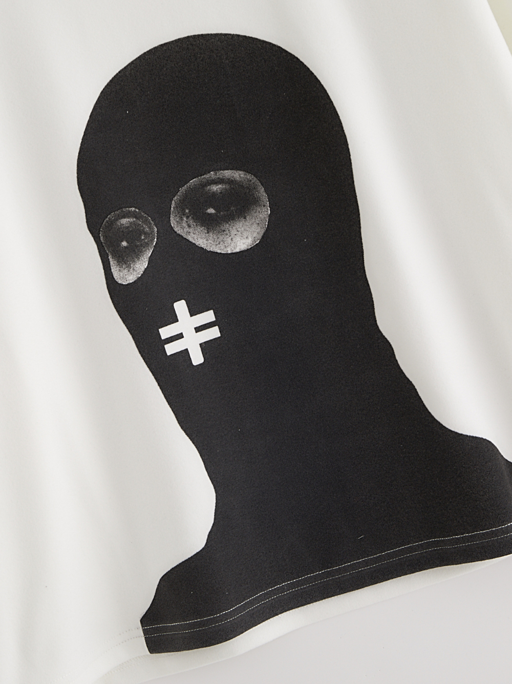 Rare Blaq white oversized graphic t shirt at unseen grail. local brands south africa. streetwear. men and women. studio image close up