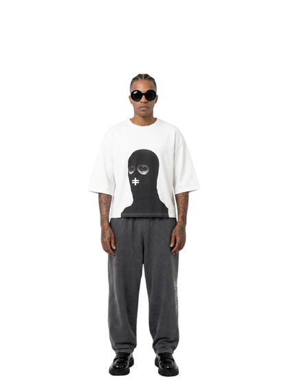 Rare Blaq white oversized graphic t shirt at unseen grail. local brands south africa. streetwear. men and women. studio image male model full outfit front