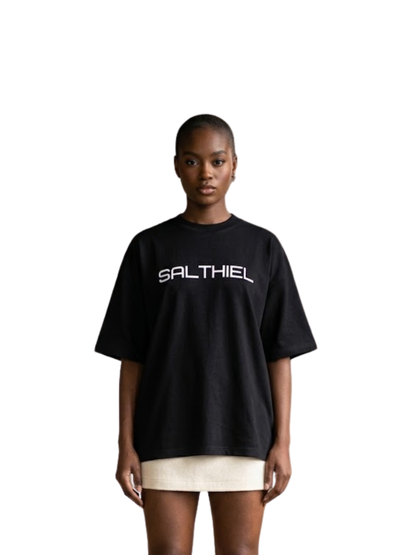 Salthiel black toversized graphic t shirt at unseen grail. local brands south africa. streetwear. men and women. female model