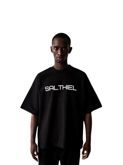 Salthiel black toversized graphic t shirt at unseen grail. local brands south africa. streetwear. men and women. male model