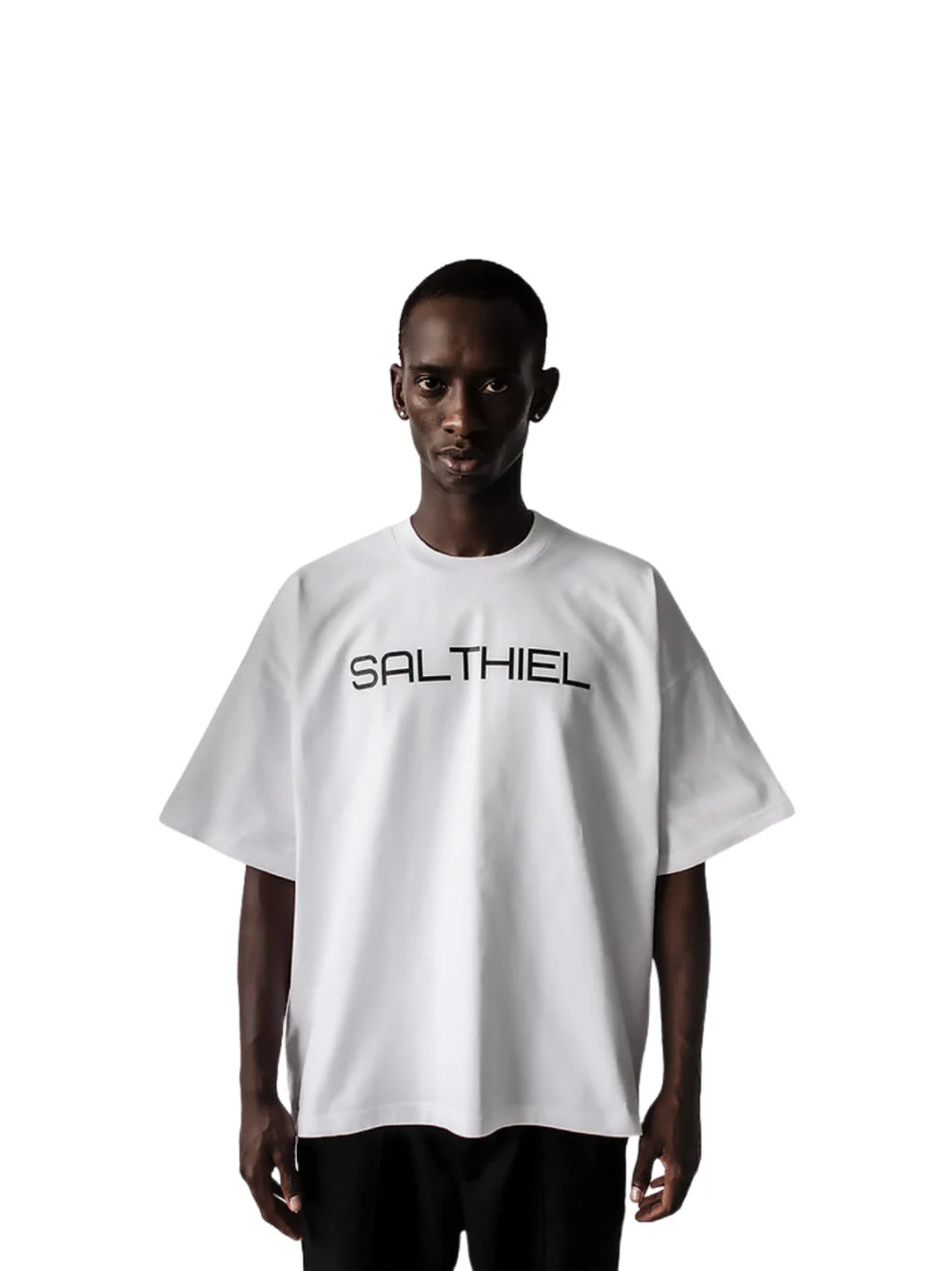 Salthiel white toversized graphic t shirt at unseen grail. local brands south africa. streetwear. men and women. male model front view