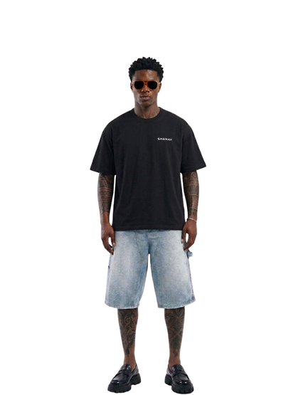 Shanay Davids black oversized graphic t shirt at unseen grail. local brands south africa. streetwear. men and women. studio image male model full outfit. galxboy. el patron. bantu.