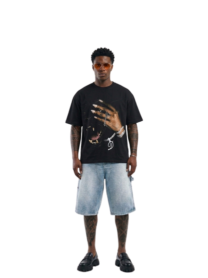 Shanay Davids black oversized graphic t shirt at unseen grail. local brands south africa. streetwear. men and women. studio image male model full outfit