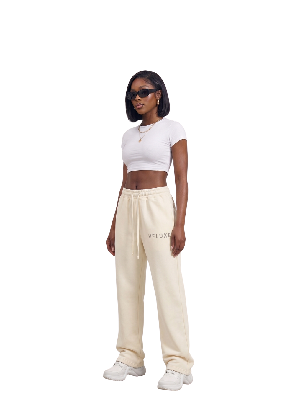 Veluxe beige oversized graphic sweatpants at unseen grail. local brands south africa. streetwear. men and women. studio image female model