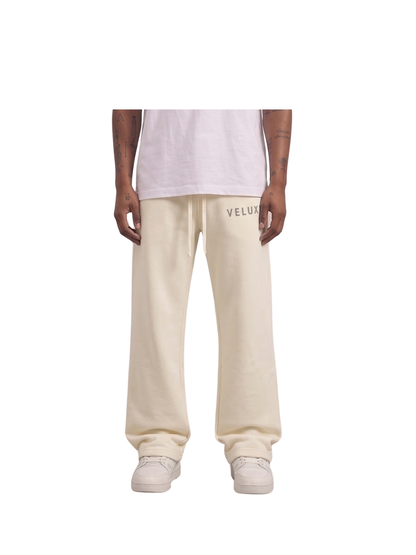 Veluxe beige oversized graphic sweatpants at unseen grail. local brands south africa. streetwear. men and women. studio image male model
