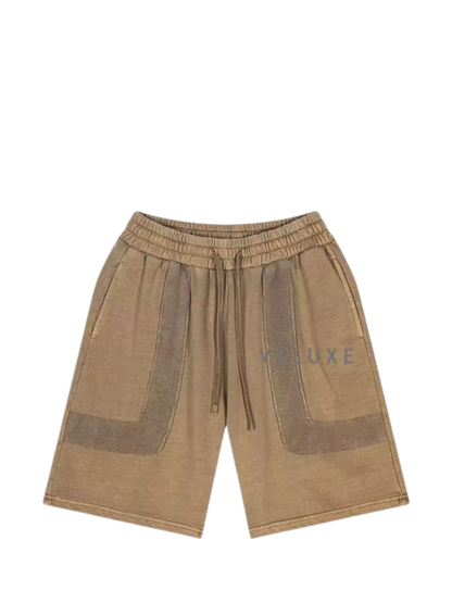 Veluxe brown oversized graphic shorts at unseen grail. local brands south africa. streetwear. men and women. studio image