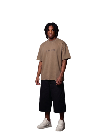 Veluxe brown oversized graphic t shirt at unseen grail. local brands south africa. streetwear. men and women. studio image male model full outfit