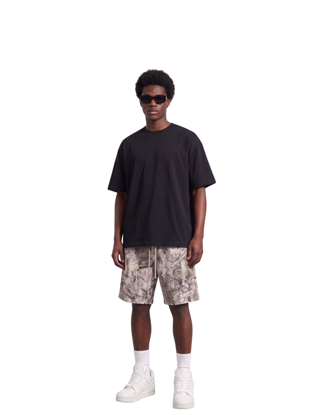 Veluxe camo oversized graphic shorts at unseen grail. local brands south africa. streetwear. men and women. studio image male model