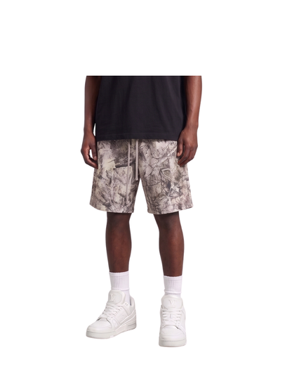 Veluxe camo oversized graphic shorts at unseen grail. local brands south africa. streetwear. men and women. studio image male model full outfit
