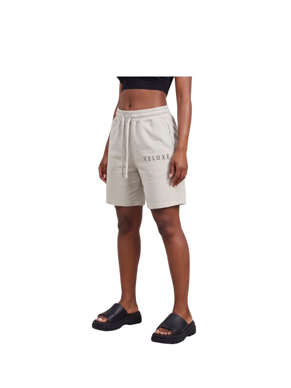 Veluxe grey oversized graphic shorts at unseen grail. local brands south africa. streetwear. men and women. studio image female model front