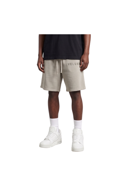 Veluxe grey oversized graphic shorts at unseen grail. local brands south africa. streetwear. men and women. studio image male model front