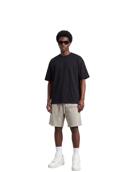 Veluxe grey oversized graphic shorts at unseen grail. local brands south africa. streetwear. men and women. studio image male model full outfit