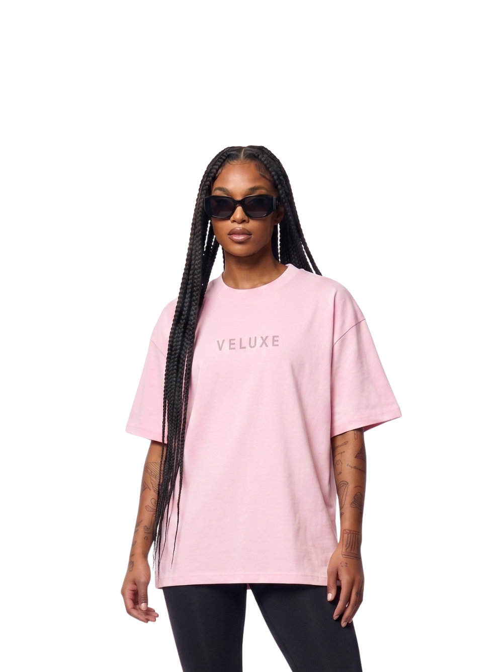 Veluxe pink oversized graphic t shirt at unseen grail. local brands south africa. streetwear. men and women. studio image female model