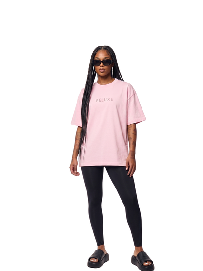 Veluxe pink oversized graphic t shirt at unseen grail. local brands south africa. streetwear. men and women. studio image female model full outfit