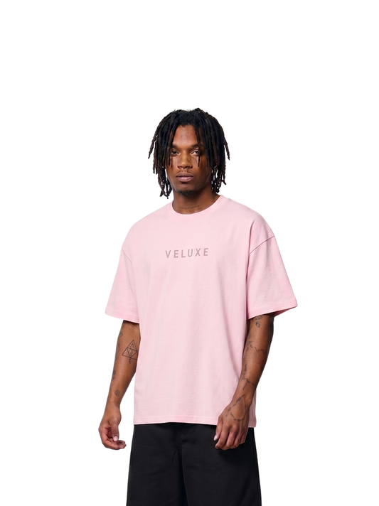 Veluxe pink oversized graphic t shirt at unseen grail. local brands south africa. streetwear. men and women. studio image male model