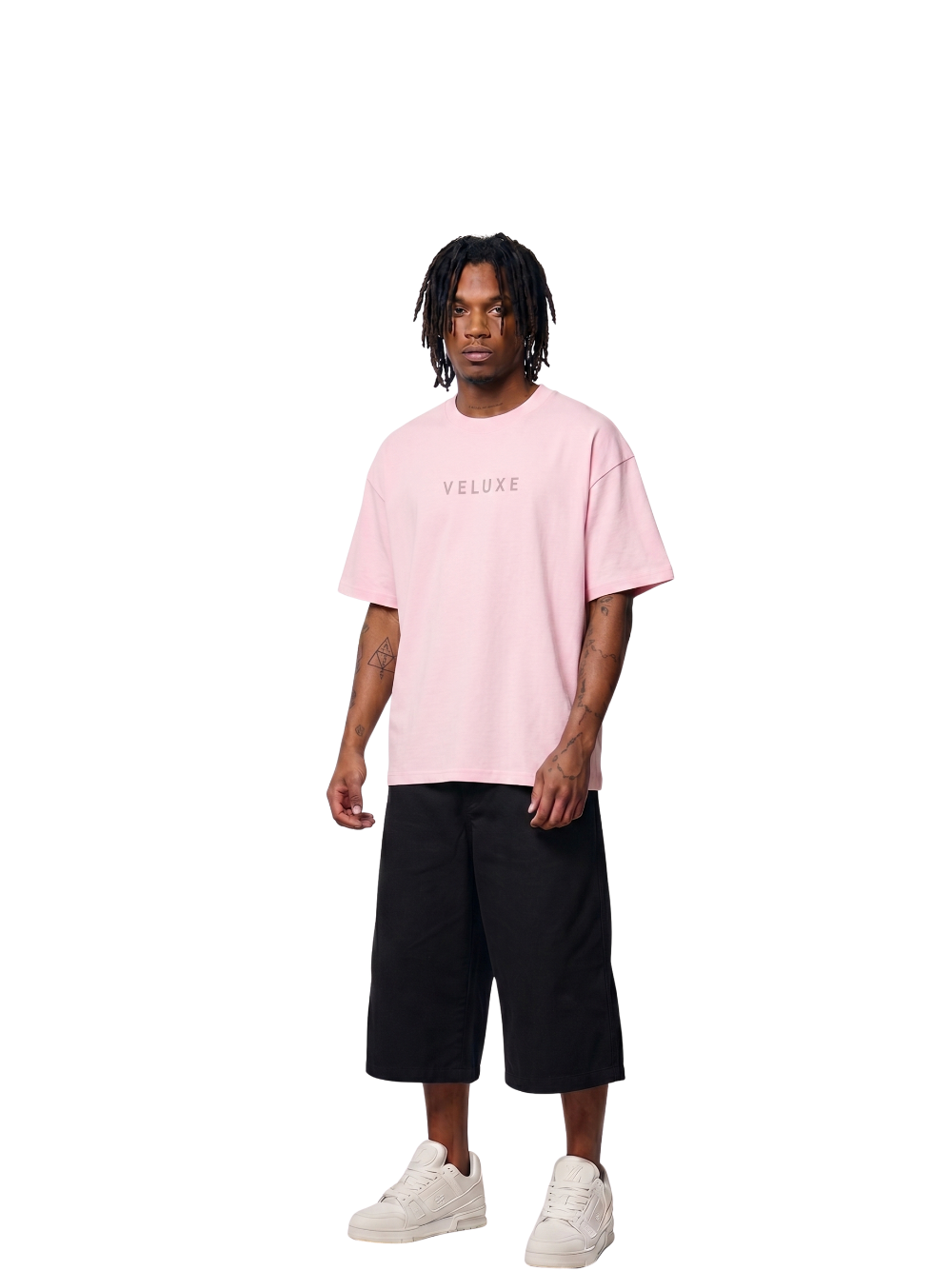 Veluxe pink oversized graphic t shirt at unseen grail. local brands south africa. streetwear. men and women. studio image male model full outfit