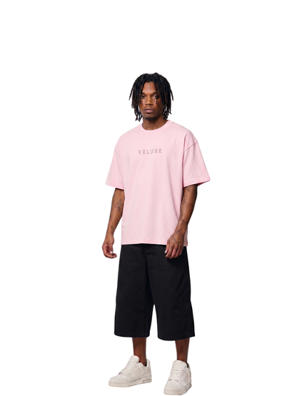 Veluxe pink oversized graphic t shirt at unseen grail. local brands south africa. streetwear. men and women. studio image male model full outfit