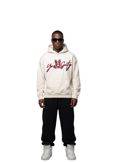 Yowgaty beige oversized graphic hoodie at unseen grail. local brands south africa. streetwear. men and women. studio image front male model galxboy, bantu, drip full outfit