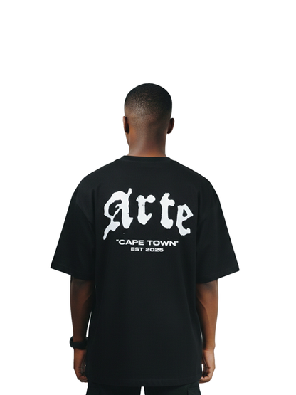 arte black oversized graphic t shirt at unseen grail. local brands south africa. streetwear. men and women. galxboy. bantu. el patron. behind male model