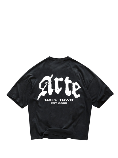 arte black oversized graphic t shirt at unseen grail. local brands south africa. streetwear. men and women. galxboy. bantu. el patron. flat lay image behind